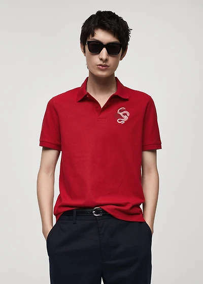 100% cotton polo shirt with embroidered graphic on the chest
