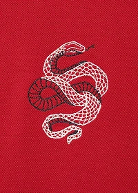 100% cotton polo shirt with embroidered graphic on the chest