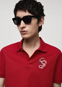 100% cotton polo shirt with embroidered graphic on the chest