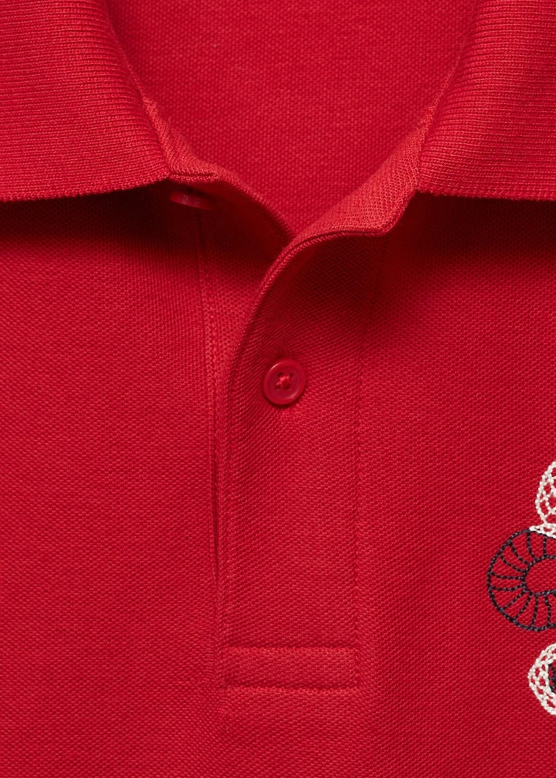 100% cotton polo shirt with embroidered graphic on the chest