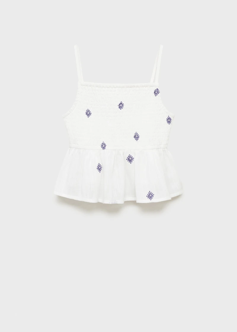 Ruffled blouse with embroidered details