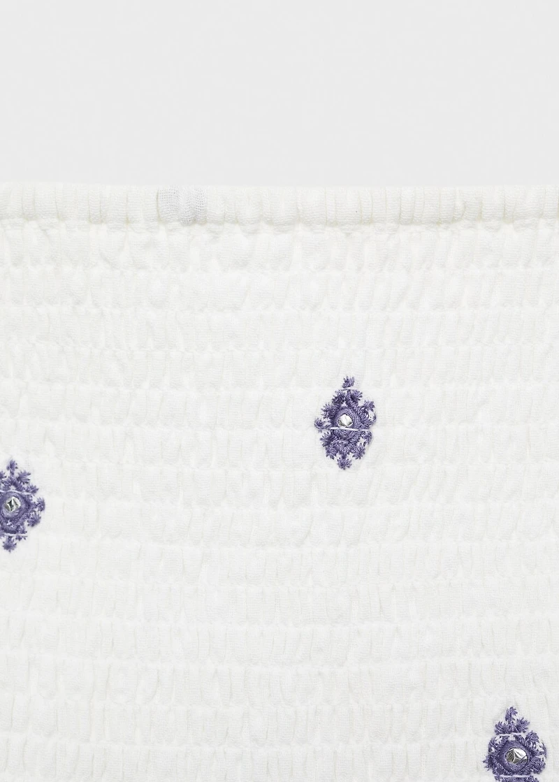 Ruffled blouse with embroidered details