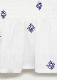 Ruffled blouse with embroidered details