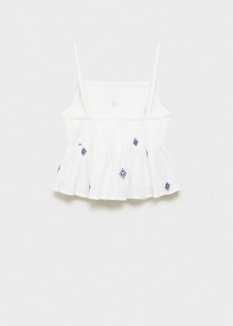 Ruffled blouse with embroidered details