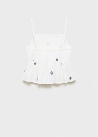 Ruffled blouse with embroidered details