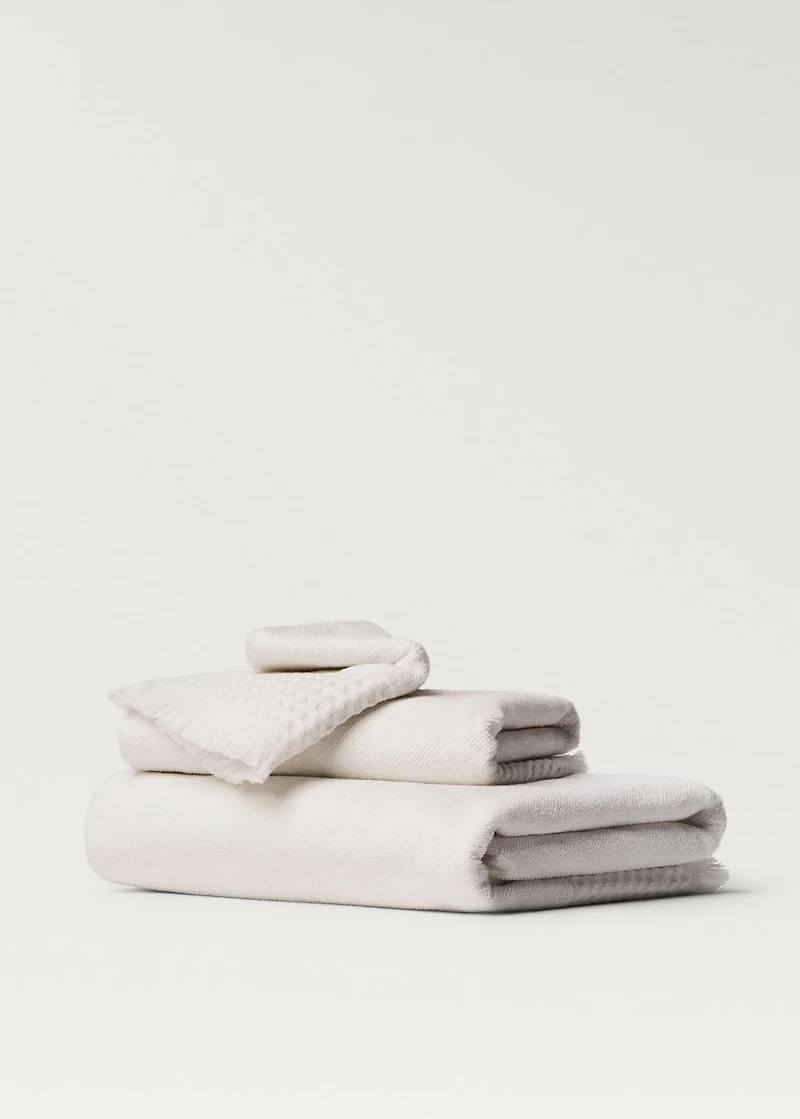 Hand towel with waffle trim and fringe