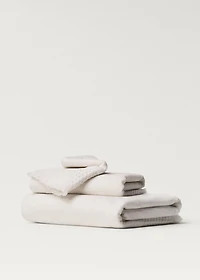 Hand towel with waffle trim and fringe