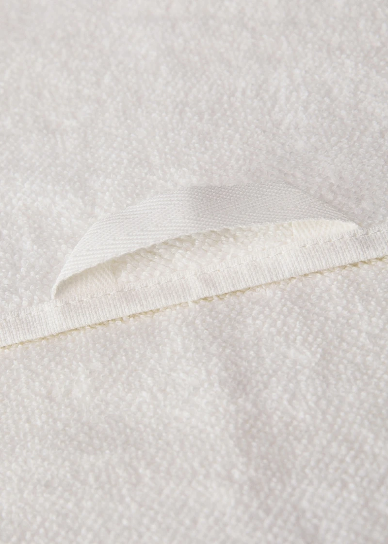 Hand towel with waffle trim and fringe