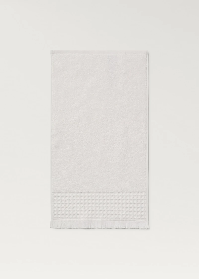 Hand towel with waffle trim and fringe