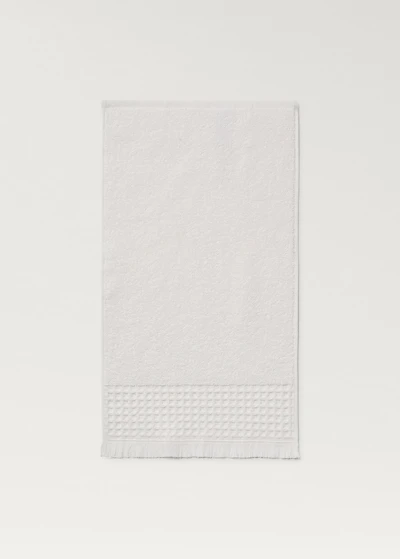 Hand towel with waffle trim and fringe