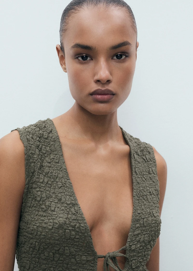 Textured top with bow