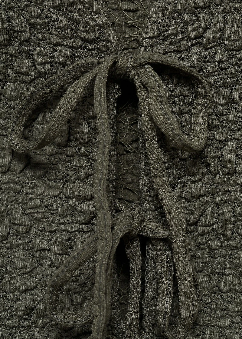 Textured top with bow