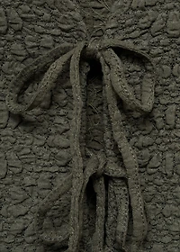 Textured top with bow