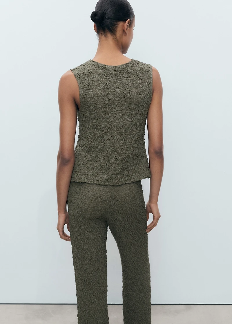 Textured top with bow