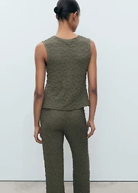 Textured top with bow