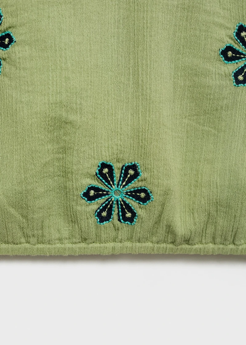 Asymmetrical embroidered top