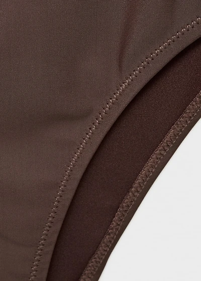 Asymmetrical swimsuit with metallic details