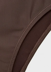 Asymmetrical swimsuit with metallic details