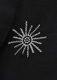 Embroidered top with bow closure