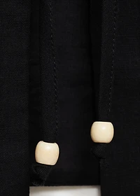 Embroidered top with bow closure