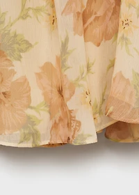 Open-back floral blouse