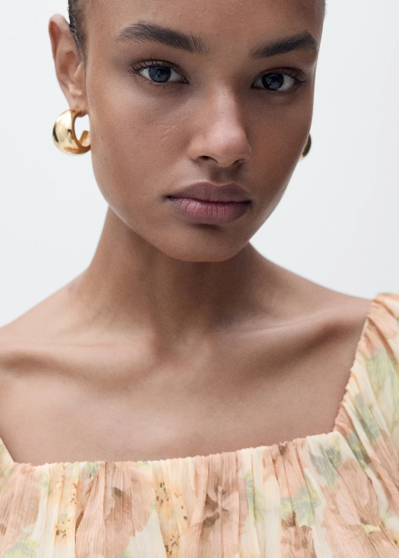 Open-back floral blouse