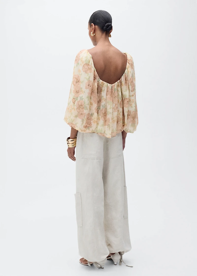 Open-back floral blouse