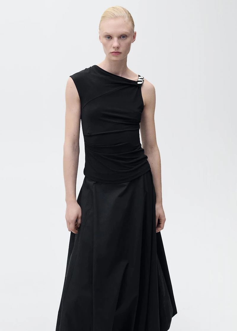 Asymmetrical top with metallic appliqué