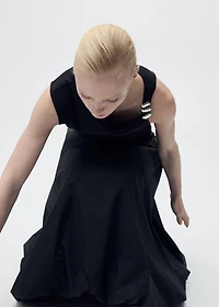 Asymmetrical top with metallic appliqué