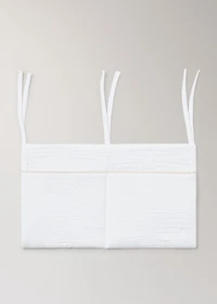 Cot organizer with piping