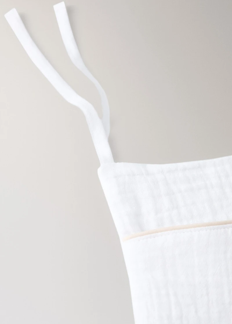 Cot organizer with piping