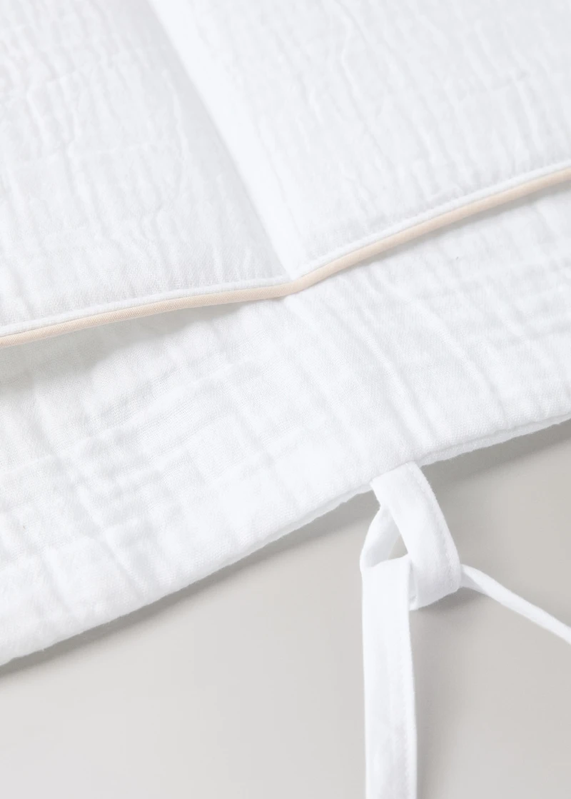 Cot organizer with piping