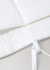 Cot organizer with piping