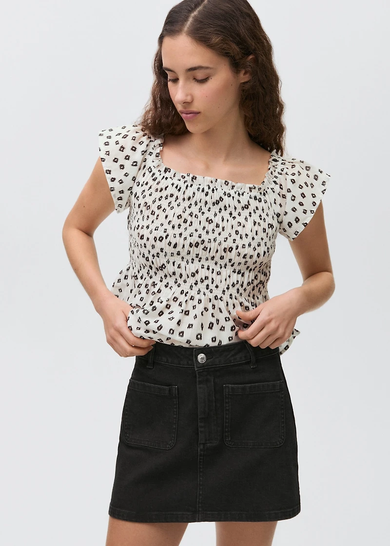 Denim mini-skirt with pockets