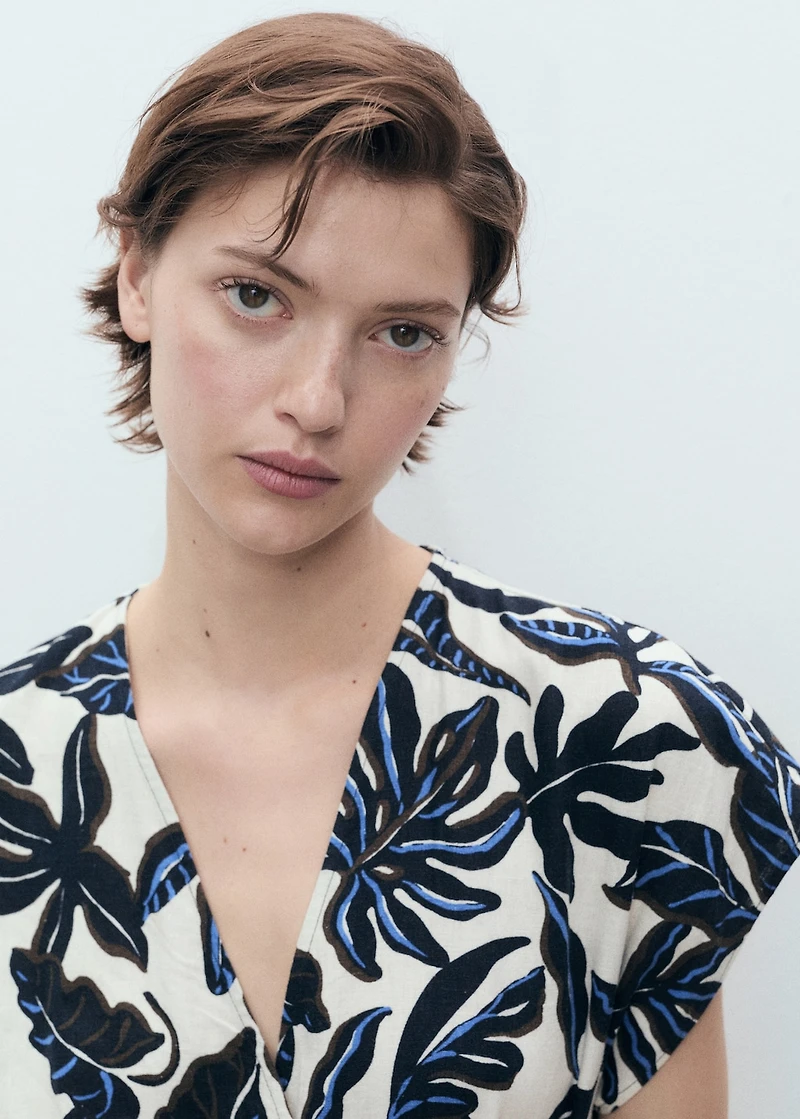 Printed linen jumpsuit with belt