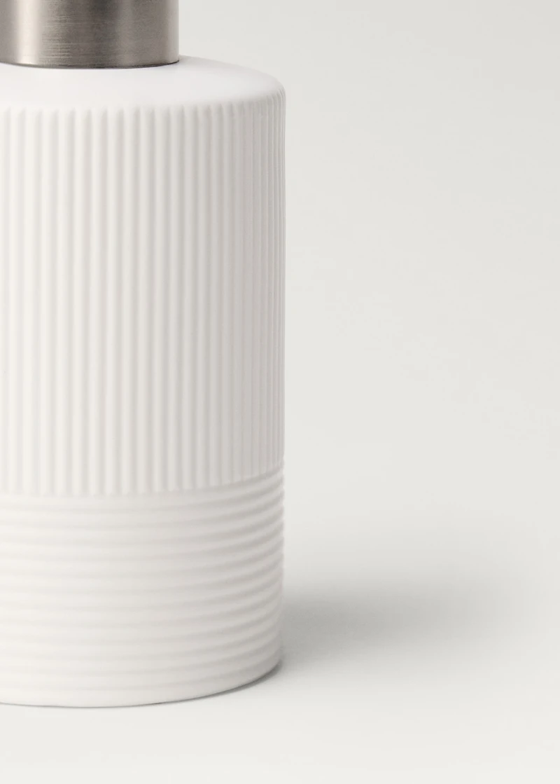 Stoneware soap dispenser with relief