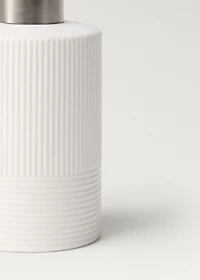 Stoneware soap dispenser with relief