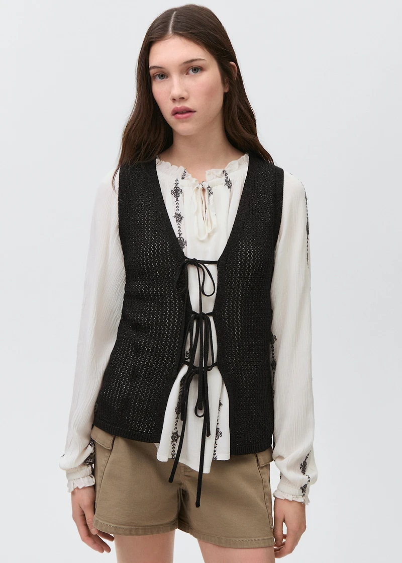 Knitted vest with lace pattern
