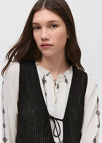 Knitted vest with lace pattern