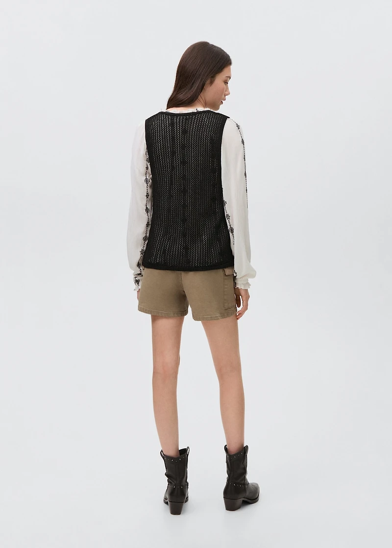 Knitted vest with lace pattern
