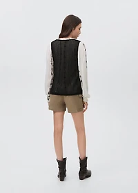 Knitted vest with lace pattern