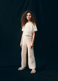 Knitted pants with crochet detail