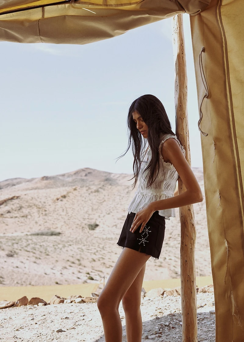 Studded denim shorts