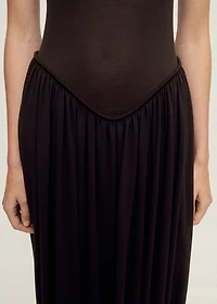 Semi-transparent dress with puffed hem