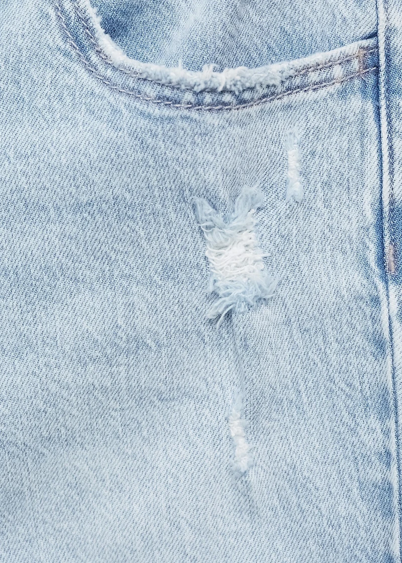 Flared jeans with decorative rips