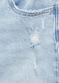 Flared jeans with decorative rips