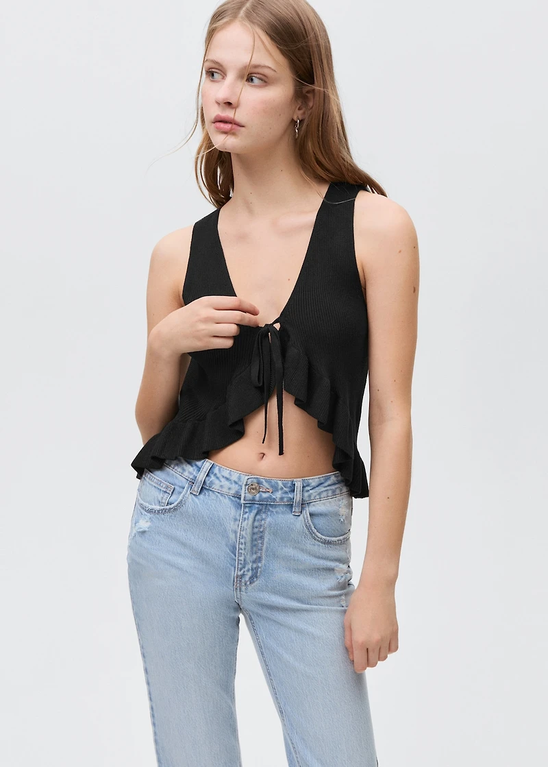 Flared jeans with decorative rips