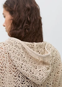 Knitted sweater with hood and lace pattern