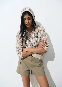 Knitted sweater with hood and lace pattern