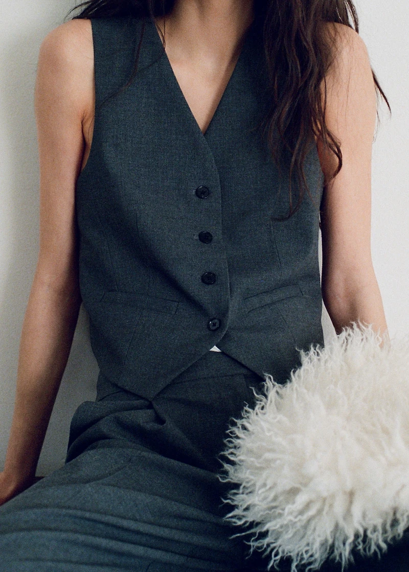 Vest with adjustable belt